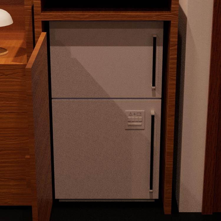 木の戸棚の扉を開けると現れた白い冷蔵庫。下段の扉に小さな装置が付いている